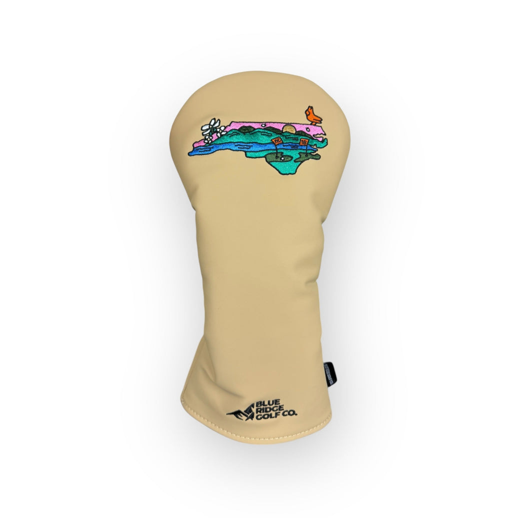 Beige golf club head cover with colorful design on a white background