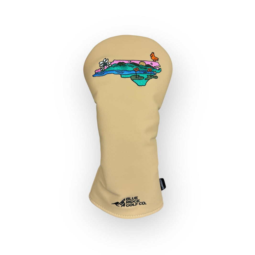Beige golf club head cover with colorful design on a white background