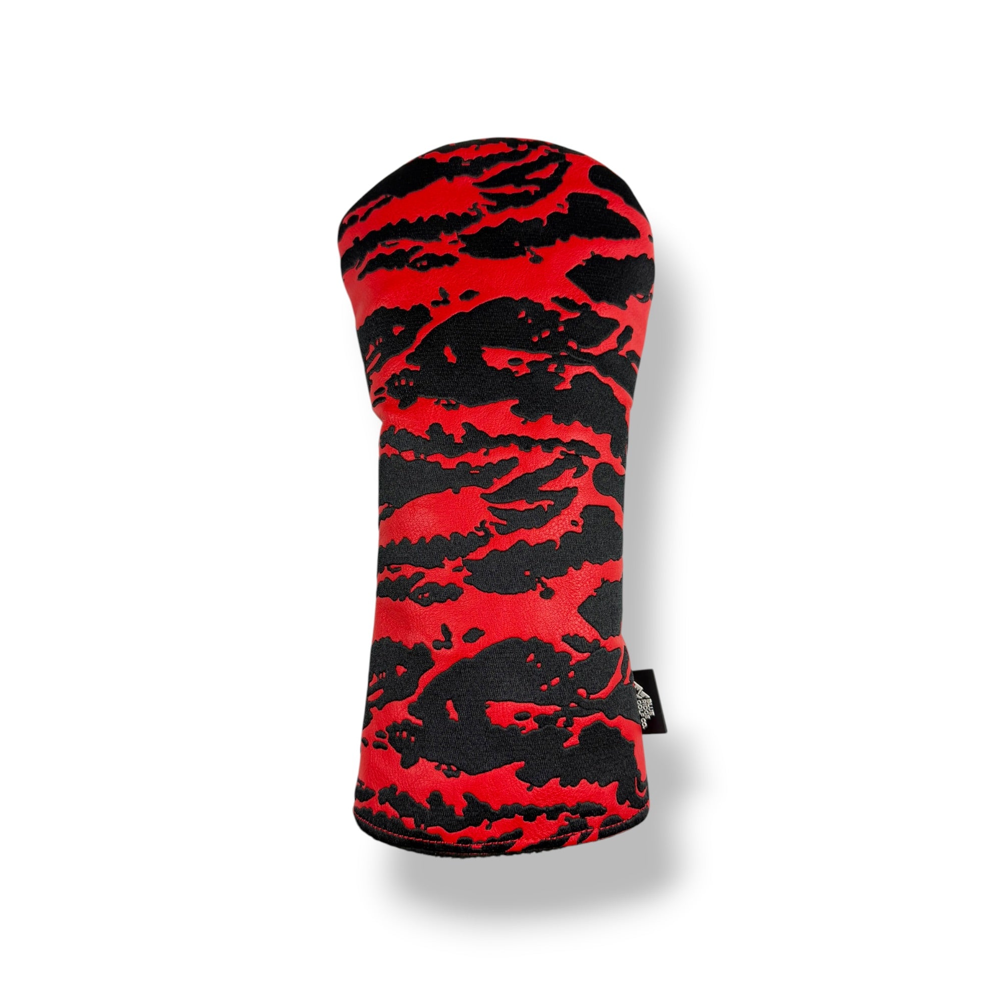 A golf club headcover with a bold red and black abstract tiger-stripe pattern, shown on a clean white background with a soft drop shadow.
