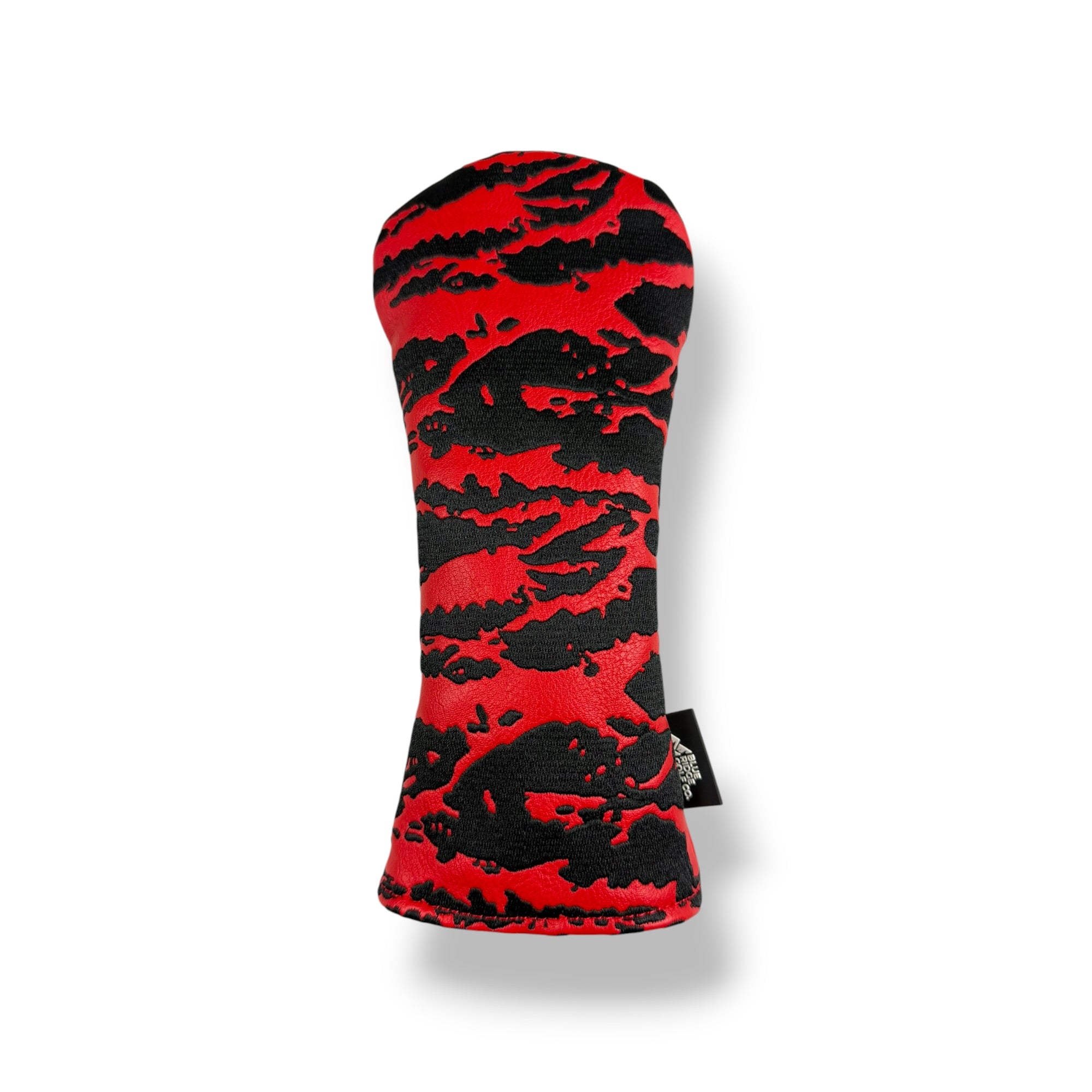 A golf club headcover with a bold red and black tiger stripe pattern, shown on a clean white background with a soft drop shadow.