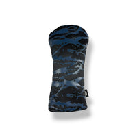 A golf club headcover featuring a dark blue and black cloud-like camouflage pattern, shown on a clean white background with a soft drop shadow.