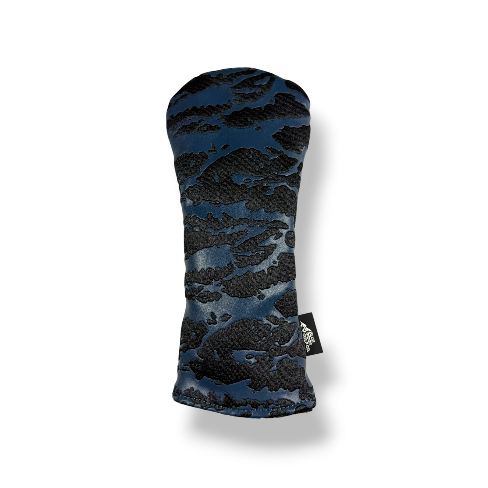 A golf club headcover featuring a textured, raised cloud-like pattern in dark blue and black, with a small black brand tag on the lower right side, set against a plain white background.